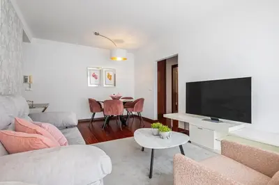 a living room with a couch and a tv at Fifth Apartment by Homie in Funchal