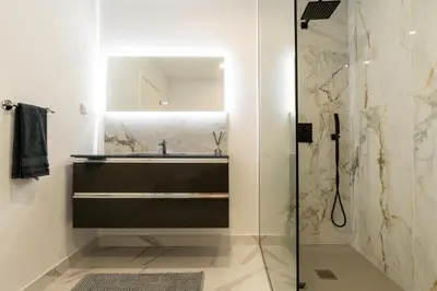a bathroom with a sink and a shower at Villa Rocha in Arco da Calheta in Arco da Calheta