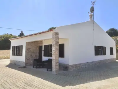 a small white house with a roof at Casa Manuel J. J. M -Alfambras, Aljezur - Quiet Country House in Aljezur