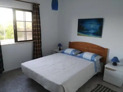 a bedroom with a bed and a window at Casa Manuel J. J. M -Alfambras, Aljezur - Quiet Country House in Aljezur