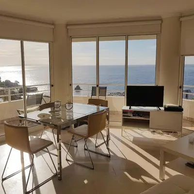 a dining room with a view of the ocean at The Sunrise of your Dreams with Total Ocean View with New Modern Kitchens 75 m2 in Funchal