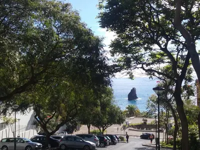 a view of the ocean from a parking lot at The Sunrise of your Dreams with Total Ocean View with New Modern Kitchens 75 m2 in Funchal