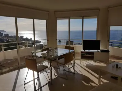 a dining room with a view of the ocean at The Sunrise of your Dreams with Total Ocean View with New Modern Kitchens 75 m2 in Funchal