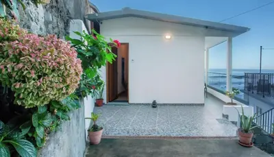 a house with a view of the ocean at Casa dos avós in São Vicente