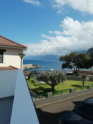 a view of the ocean from the balcony of a house at Villa Vista Norte in Porto Moniz