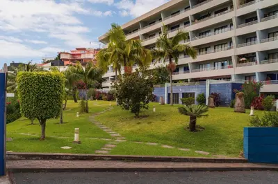 a park in front of a large building at Vista Mar I by An Island Apart in Funchal