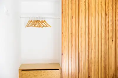 a room with a wooden wall and a wooden closet at Casa Da Avo Clementina Nº32 in Funchal