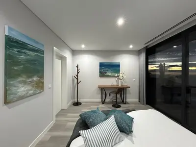 a bedroom with a bed and a table in a room at Villa Sol e Mar in Ribeira Brava