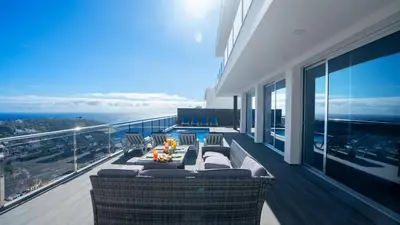 a balcony with a view of the ocean on a building at Villa Oceânica by LovelyStay in Ribeira Brava
