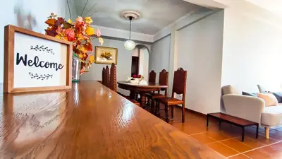 a living room with a table and a dining room at Casa Gina, with views to Funchal Bay in Funchal