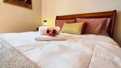a bed with towels and a pair of masks on it at Casa Gina, with views to Funchal Bay in Funchal