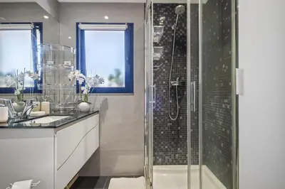a bathroom with a shower and a sink at Barreiros Balcony in Funchal