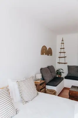 a living room with a bed and a couch at Casa Nook Arrifana in Aljezur