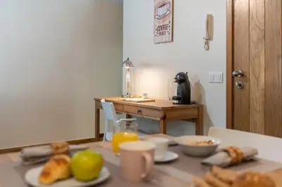 a table with plates of food on top of it at Apartamento na Praça by An Island Apart in Funchal