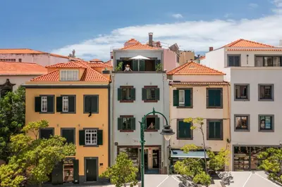 a group of buildings with red tile roofs at Apartamento na Praça by An Island Apart in Funchal