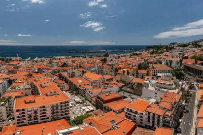 an aerial view of a city with orange roofs at Apartamento na Praça by An Island Apart in Funchal