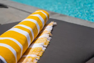 two orange and white stripes on a treadmill next to a pool at Casa Avô da Pedra, By OP in São Vicente
