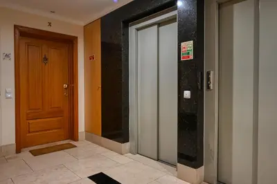 a hallway with two doors in a building at Costa do Sol, a Home in Madeira in Funchal