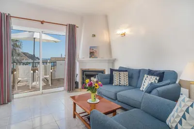 a living room with a couch and a table at Casa Azure in Luz