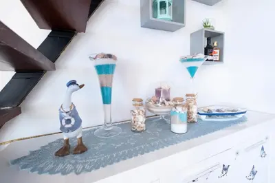 a shelf with dishes and vases on it at Terrace to Atlantic in Santa Cruz