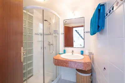 a bathroom with a sink and a shower at Terrace to Atlantic in Santa Cruz