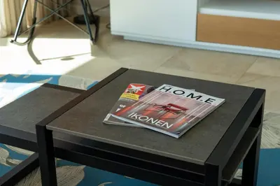 a magazine sitting on top of a table at Elísio do Mar by LovelyStay in Prazeres