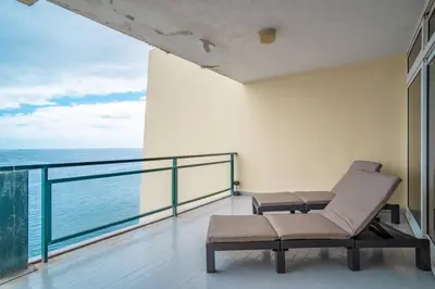 a balcony with a view of the ocean at Atlantic Garden Front Praia Formosa in Funchal