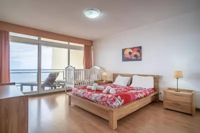a dining room with a view of the ocean at Atlantic Garden Front Praia Formosa in Funchal