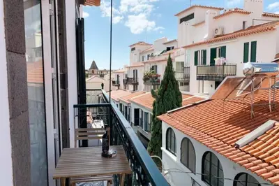 a balcony with a view of a city with buildings at Apartment Primavera: City centre, modern w/balcony in Funchal