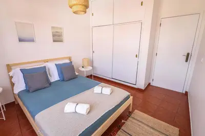 a hallway with three framed pictures on a wall at SandyBeachApartment in Porto Santo