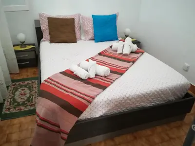 a bedroom with two beds with stuffed animals on them at Casa Zona Velha - Caetano in Funchal