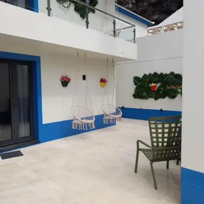a room with chairs and plants on the wall at Mediterrâneo Madeira in São Vicente