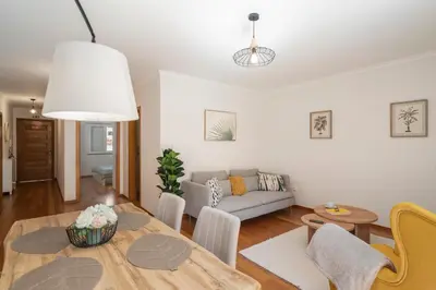 a living room with a table and a couch at Ribeira Brava I by An Island Apart in Ribeira Brava