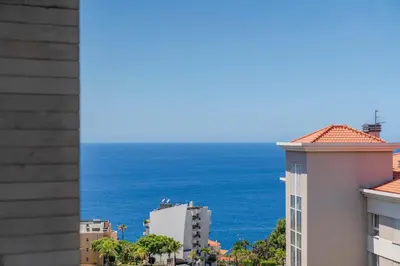a view of the ocean from a building at Ajuda IV by An Island Apart in Funchal