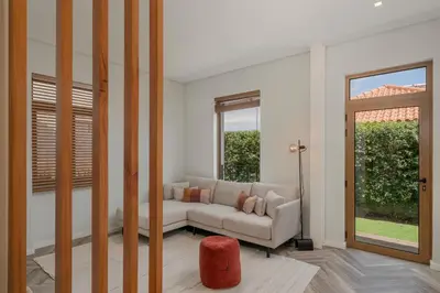 a living room with a couch and a window at Casa da Amoreira by An Island Apart in Funchal