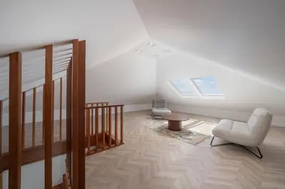 a living room with a chair and a table at Casa da Amoreira by An Island Apart in Funchal