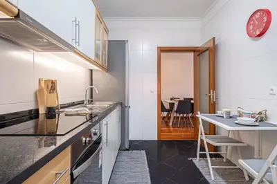 a kitchen with a sink and a counter top at Ficcus Home in Caniço