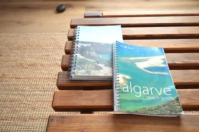 a book sitting on top of a wooden bench at Mola Mola Sagres in Sagres