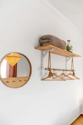 a mirror and a shelf on a wall at Mola Mola Sagres in Sagres