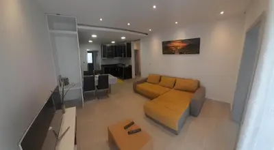 a living room with a couch and a table at Santo Relaxium in Ponta do Sol