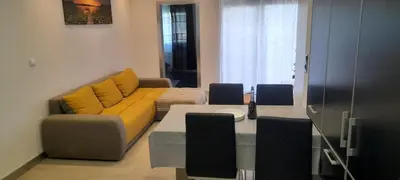 a living room with a couch and a table at Santo Relaxium in Ponta do Sol