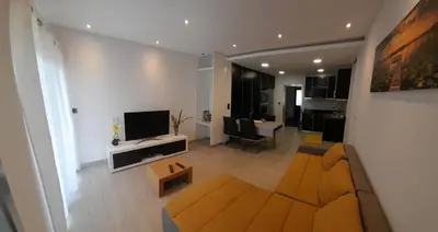 a living room with a couch and a tv in a room at Santo Relaxium in Ponta do Sol
