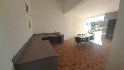 a kitchen and dining room with a table and chairs at Santo Relaxium in Ponta do Sol