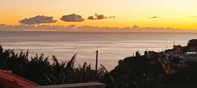a view of the ocean at sunset at Santo Relaxium in Ponta do Sol