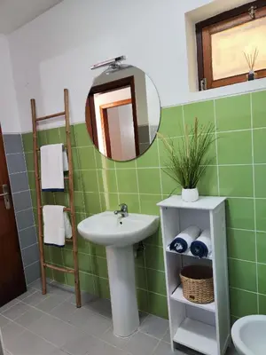 a bathroom with a sink and a mirror at Machico Terrace in Machico