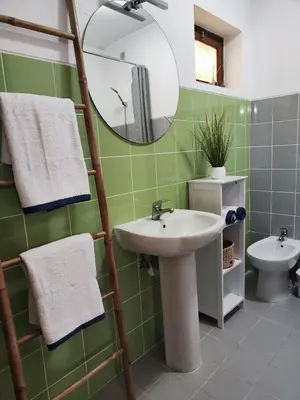 a bathroom with a sink and a mirror at Machico Terrace in Machico