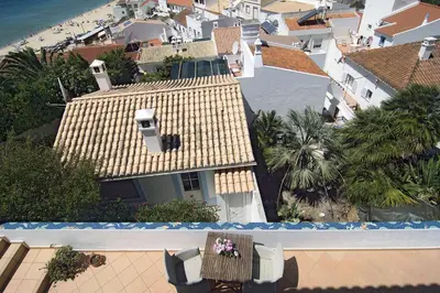 an overhead view of a house and a pool at Casa Sereia Praia in Salema