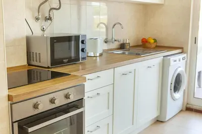 a kitchen with a microwave oven and a sink at B68 - Luz Vista Mar Apartment in Luz