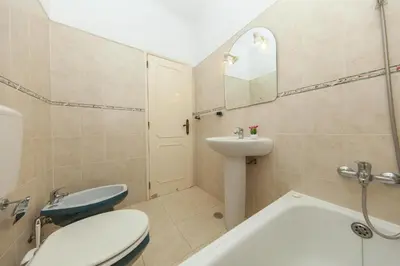 a bathroom with a toilet and a sink and a tub at B68 - Luz Vista Mar Apartment in Luz