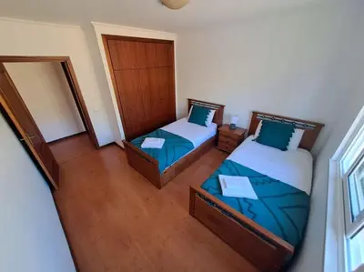 an overhead view of a bedroom with two beds at Ocean Gardens in Caniço